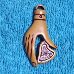 Unique Hand-Shaped Pendant with Heart